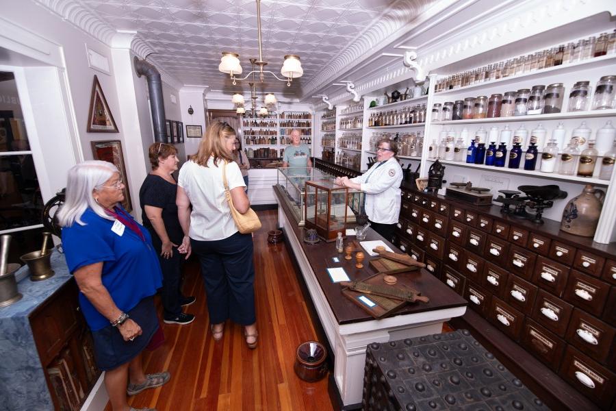 Alumni group tours the Throop Pharmacy Museum